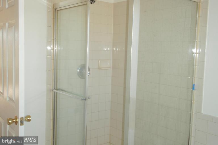 760 Holly Leaf Road Culpeper, VA 22701 - Photo 20 of 26 a bathroom with a glass shower door