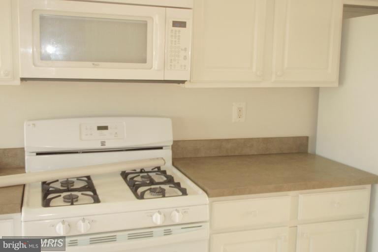 760 Holly Leaf Road Culpeper, VA 22701 - Photo 3 of 26 a utility room with dryer and washer