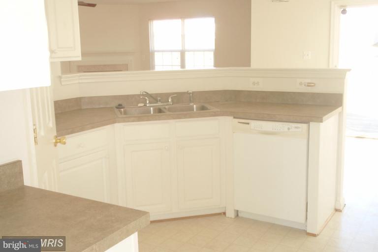 760 Holly Leaf Road Culpeper, VA 22701 - Photo 4 of 26 a view of a bathroom sink and a window