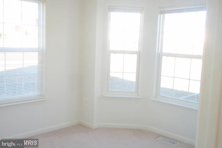 760 Holly Leaf Road Culpeper, VA 22701 - Photo 5 of 26 an empty room with a window