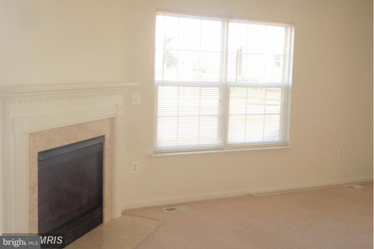 760 Holly Leaf Road Culpeper, VA 22701 - Photo 6 of 26 an empty room with a window