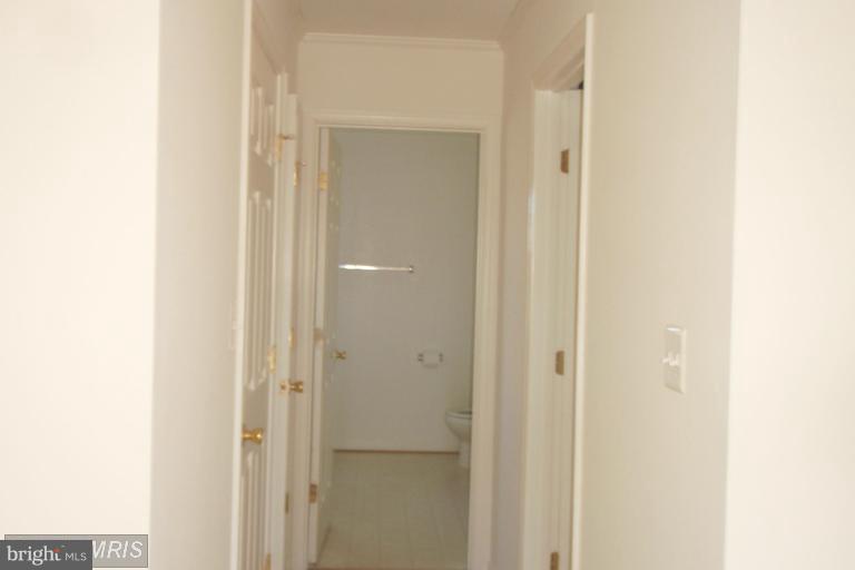 760 Holly Leaf Road Culpeper, VA 22701 - Photo 8 of 26 a view of a bathroom from a hallway