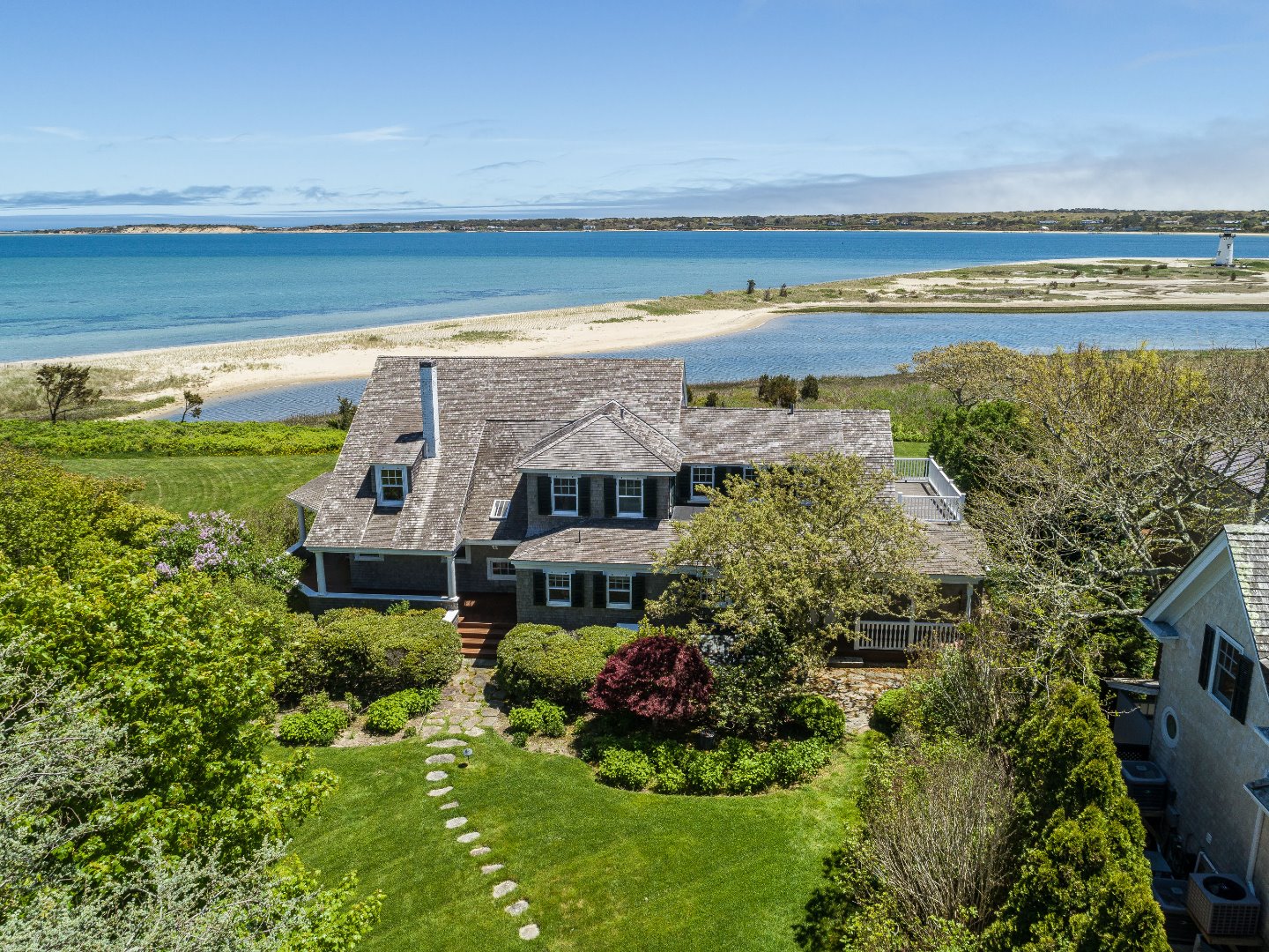 a view of a swimming pool with an outdoor seating and a garden