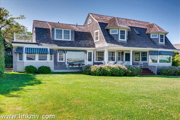 7 Starbuck Neck Road Edgartown, MA 02539 - Photo 14 of 41 a front view of a house with garden and porch