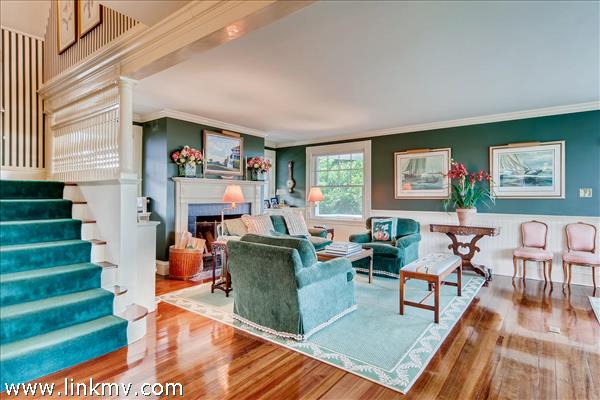 7 Starbuck Neck Road Edgartown, MA 02539 - Photo 20 of 41 a living room with furniture a fireplace and a large window