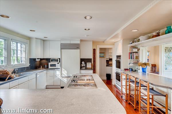 7 Starbuck Neck Road Edgartown, MA 02539 - Photo 25 of 41 a large white kitchen with stainless steel appliances