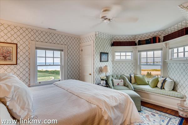 7 Starbuck Neck Road Edgartown, MA 02539 - Photo 29 of 41 a bedroom with a bed and wooden floor