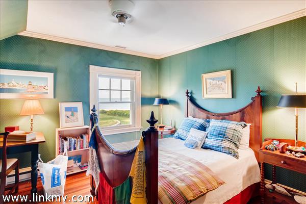 7 Starbuck Neck Road Edgartown, MA 02539 - Photo 30 of 41 a bedroom with furniture and a window