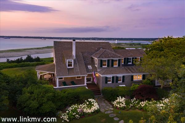 7 Starbuck Neck Road Edgartown, MA 02539 - Photo 4 of 41 a front view of a house with a yard