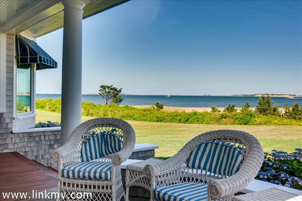 7 Starbuck Neck Road Edgartown, MA 02539 - Photo 7 of 41 a view of a swimming pool with couches and wooden floor