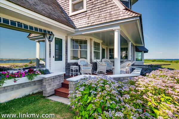 7 Starbuck Neck Road Edgartown, MA 02539 - Photo 8 of 41 a view of a house with backyard sitting area and garden