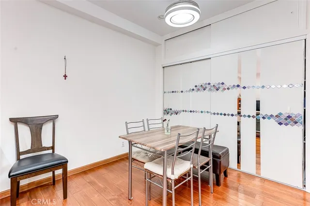 a view of a workspace with furniture and wooden floor
