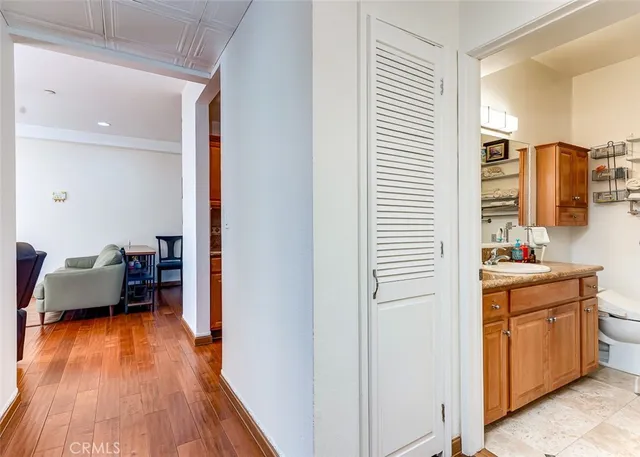 a bedroom with furniture and a wooden floor