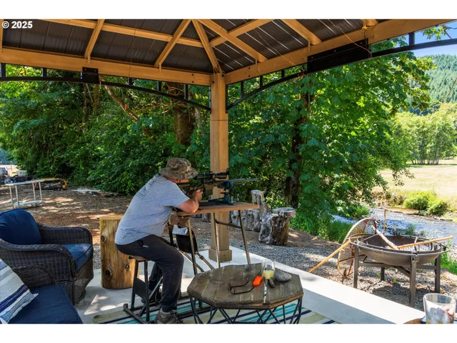 a view of yard with patio