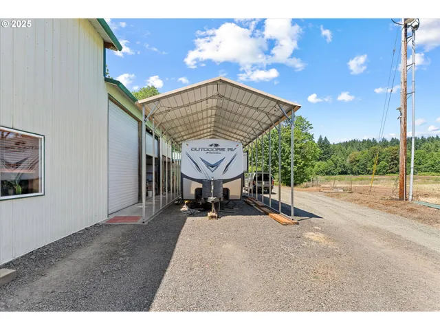 a view of a patio with a table and chairs