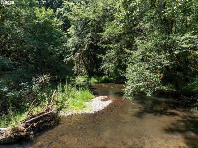 a view of lake with green space
