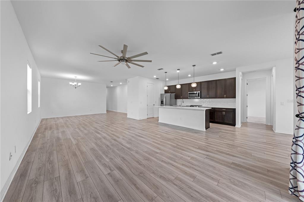 920 Livestock Loop St. Cloud, FL 34771 - Photo 16 of 55 a view of a kitchen with a dishwasher and wooden floor