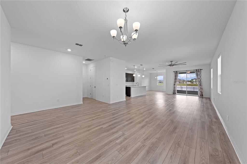 920 Livestock Loop St. Cloud, FL 34771 - Photo 23 of 55 a view of livingroom with hardwood floor and a ceiling fan