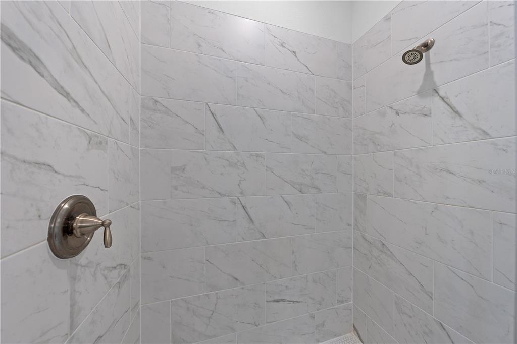 920 Livestock Loop St. Cloud, FL 34771 - Photo 30 of 55 a bathroom with shower