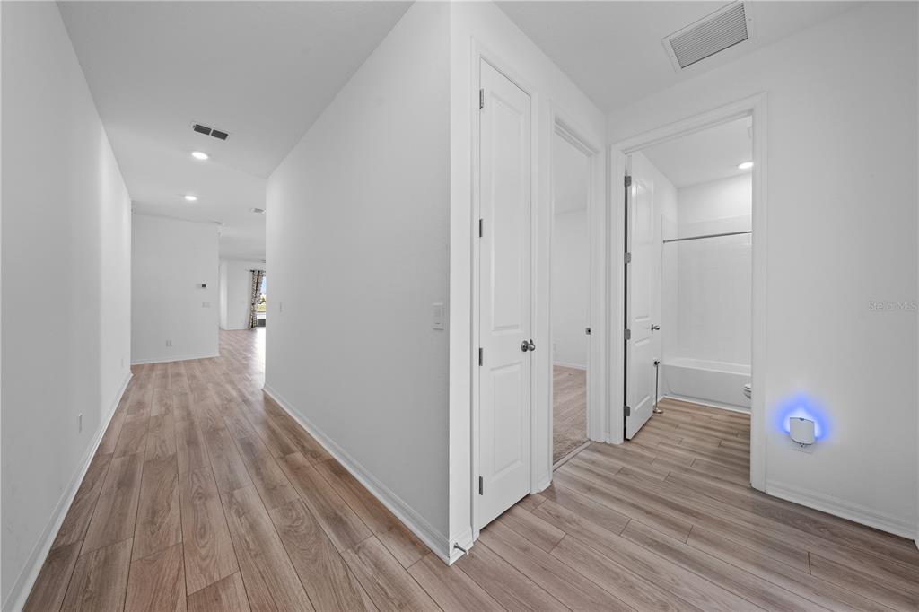 920 Livestock Loop St. Cloud, FL 34771 - Photo 32 of 55 a view of hallway with wooden floor