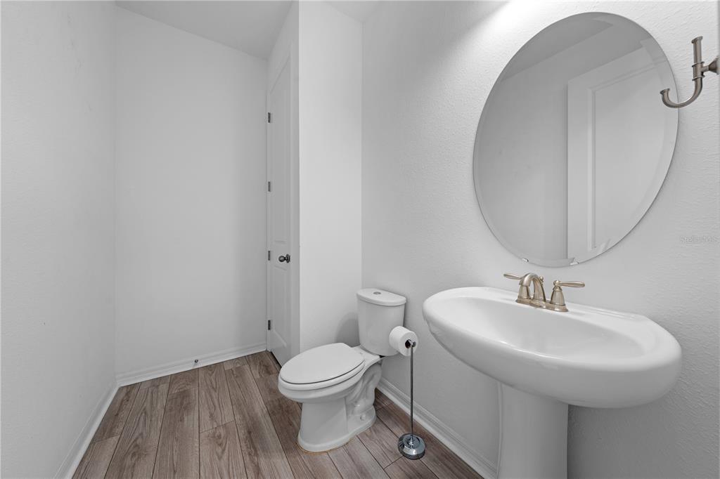 920 Livestock Loop St. Cloud, FL 34771 - Photo 37 of 55 a bathroom with a sink and a mirror