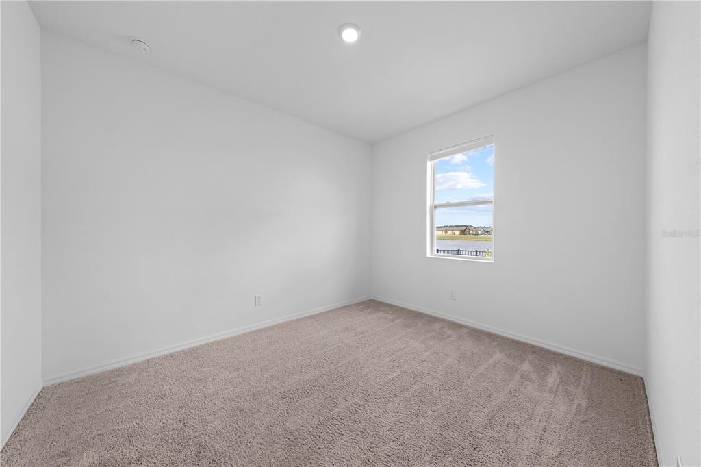 920 Livestock Loop St. Cloud, FL 34771 - Photo 38 of 55 an empty room with a window