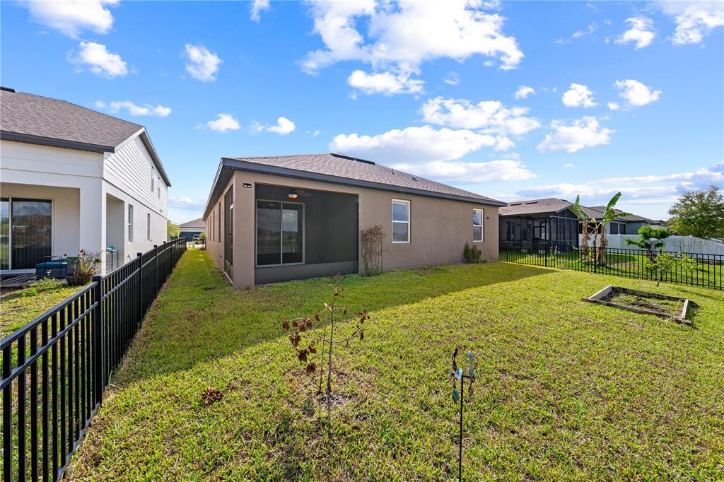 920 Livestock Loop St. Cloud, FL 34771 - Photo 45 of 55 a view of an house with backyard and garden