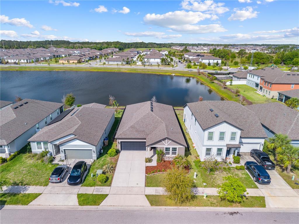 920 Livestock Loop St. Cloud, FL 34771 - Photo 49 of 55 an aerial view of residential houses with outdoor space and ocean view