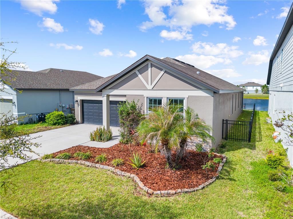 920 Livestock Loop St. Cloud, FL 34771 - Photo 5 of 55 a front view of a house with garden