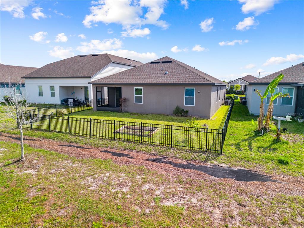 920 Livestock Loop St. Cloud, FL 34771 - Photo 51 of 55 a view of a house with pool and chairs