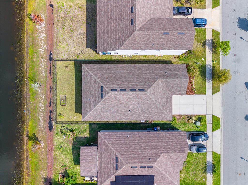 920 Livestock Loop St. Cloud, FL 34771 - Photo 52 of 55 an aerial view of a house with a garden