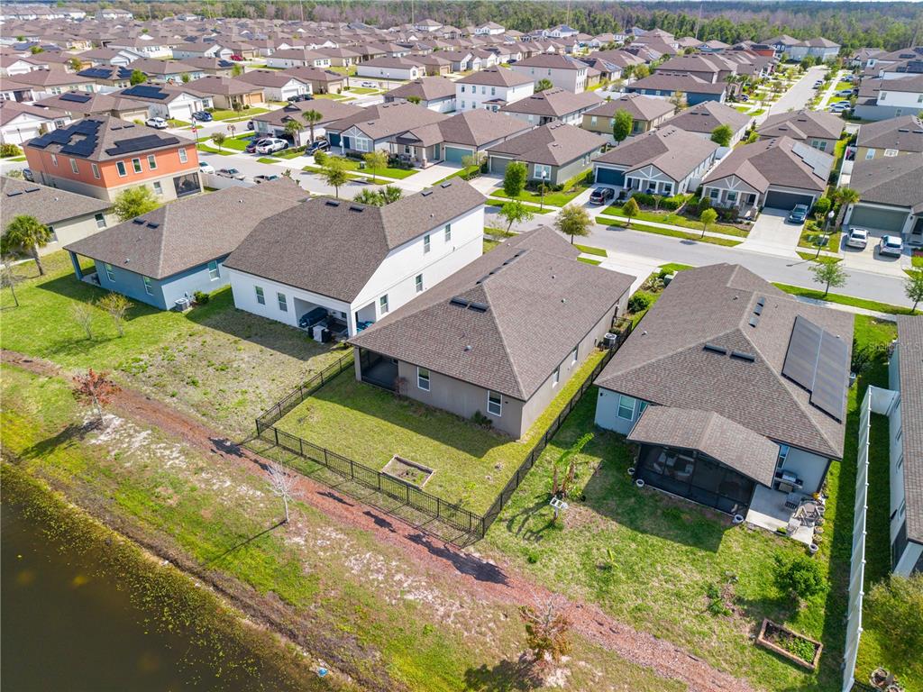 920 Livestock Loop St. Cloud, FL 34771 - Photo 54 of 55 an aerial view of a house with a garden
