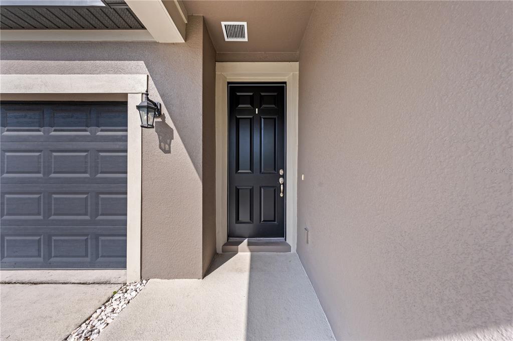 920 Livestock Loop St. Cloud, FL 34771 - Photo 6 of 55 a view of a door and a window