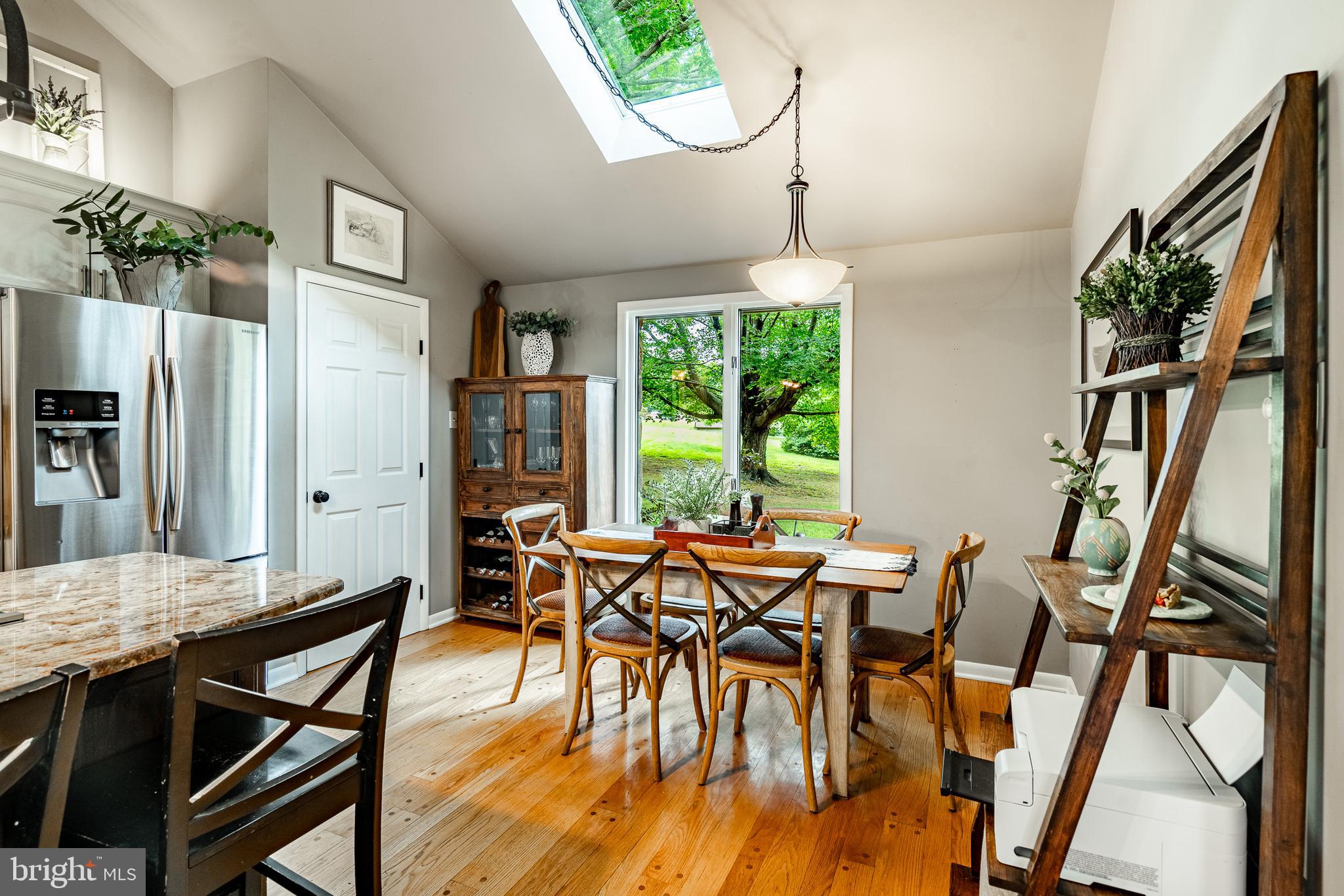 19 Ringfield Road, Unit 19 Chadds Ford, PA 19317 - Photo 11 of 39 a view of a dining room with furniture window and wooden floor