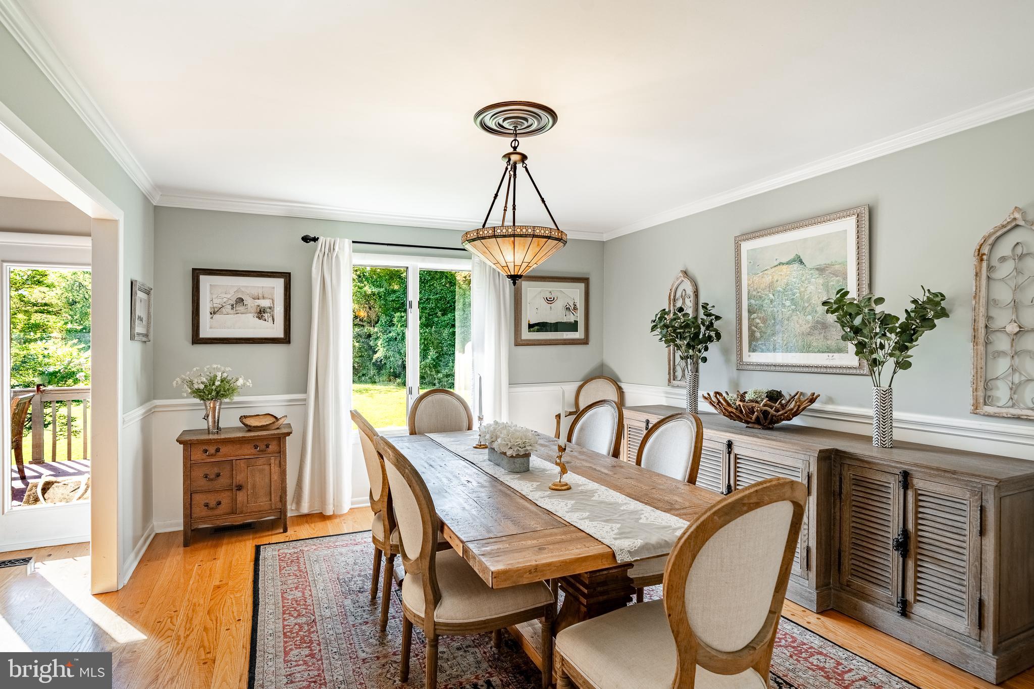 19 Ringfield Road, Unit 19 Chadds Ford, PA 19317 - Photo 16 of 39 a dining room with furniture window and wooden floor