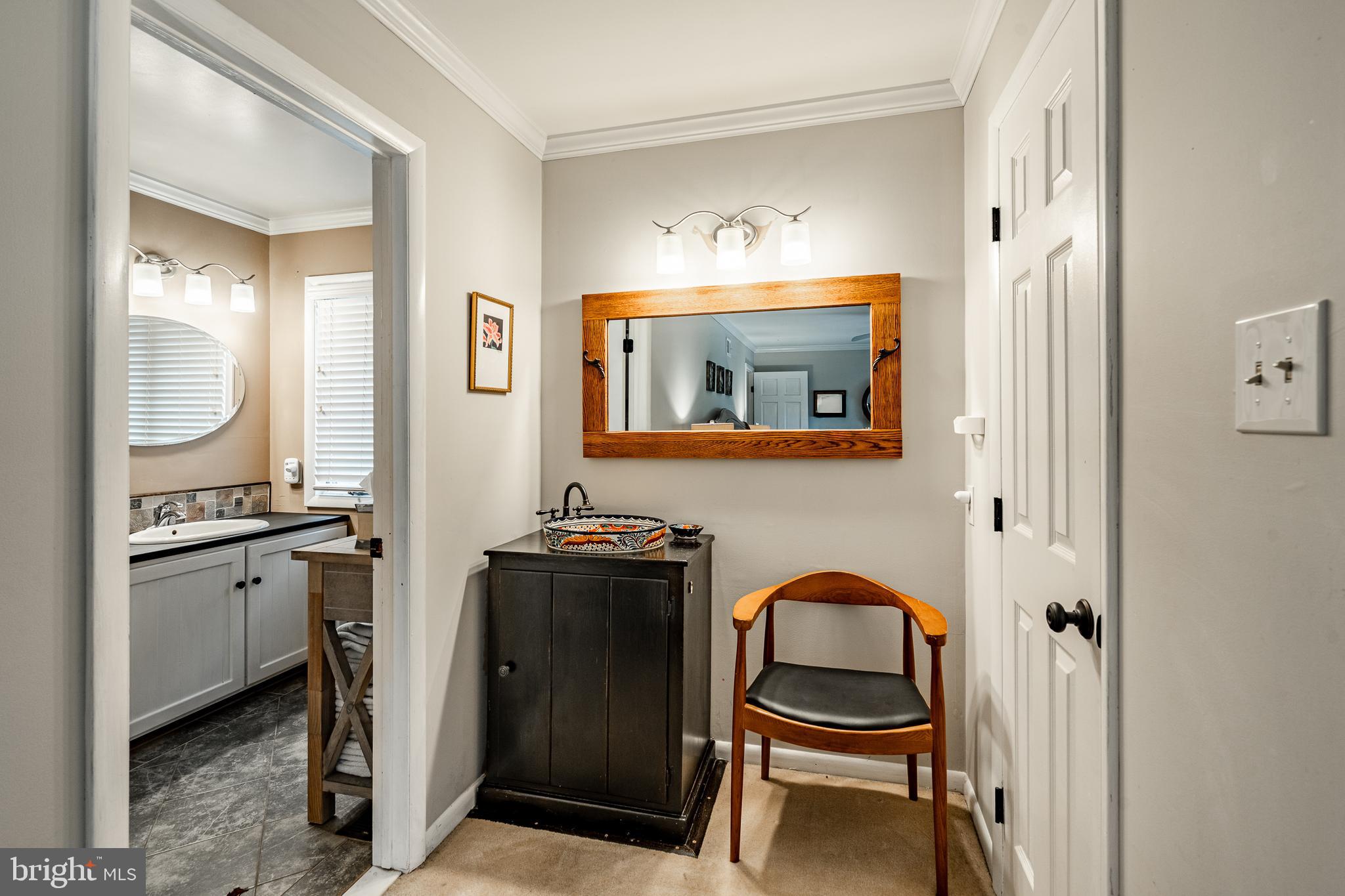 19 Ringfield Road, Unit 19 Chadds Ford, PA 19317 - Photo 21 of 39 a bathroom with a sink and a mirror