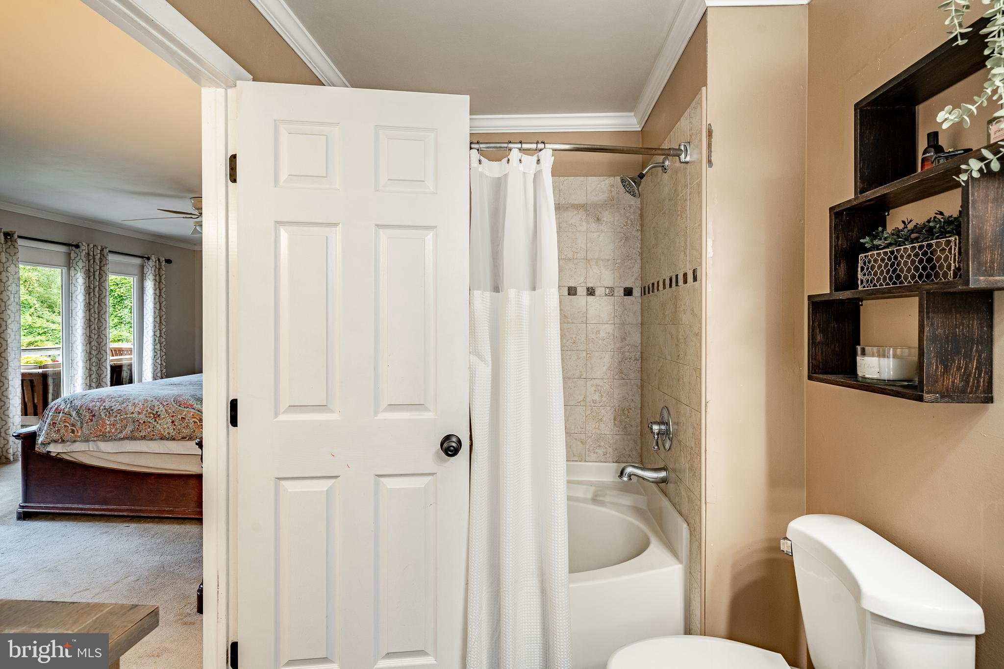 19 Ringfield Road, Unit 19 Chadds Ford, PA 19317 - Photo 23 of 39 a en suite bathroom with a granite countertop tub shower and a sink