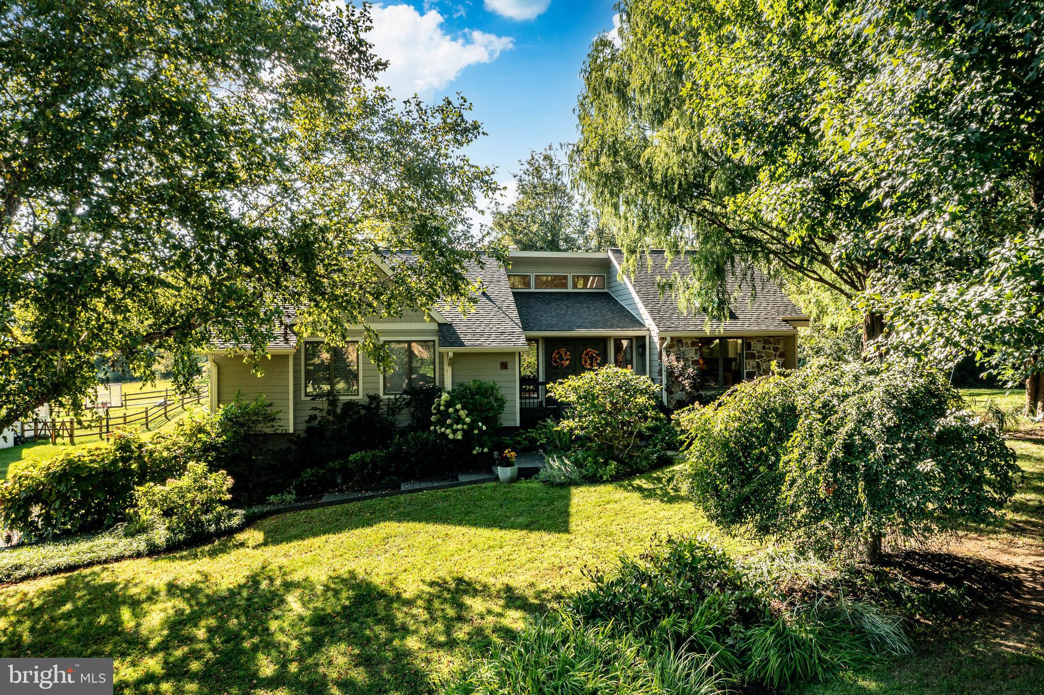 19 Ringfield Road, Unit 19 Chadds Ford, PA 19317 - Photo 3 of 39 a front view of a house with garden