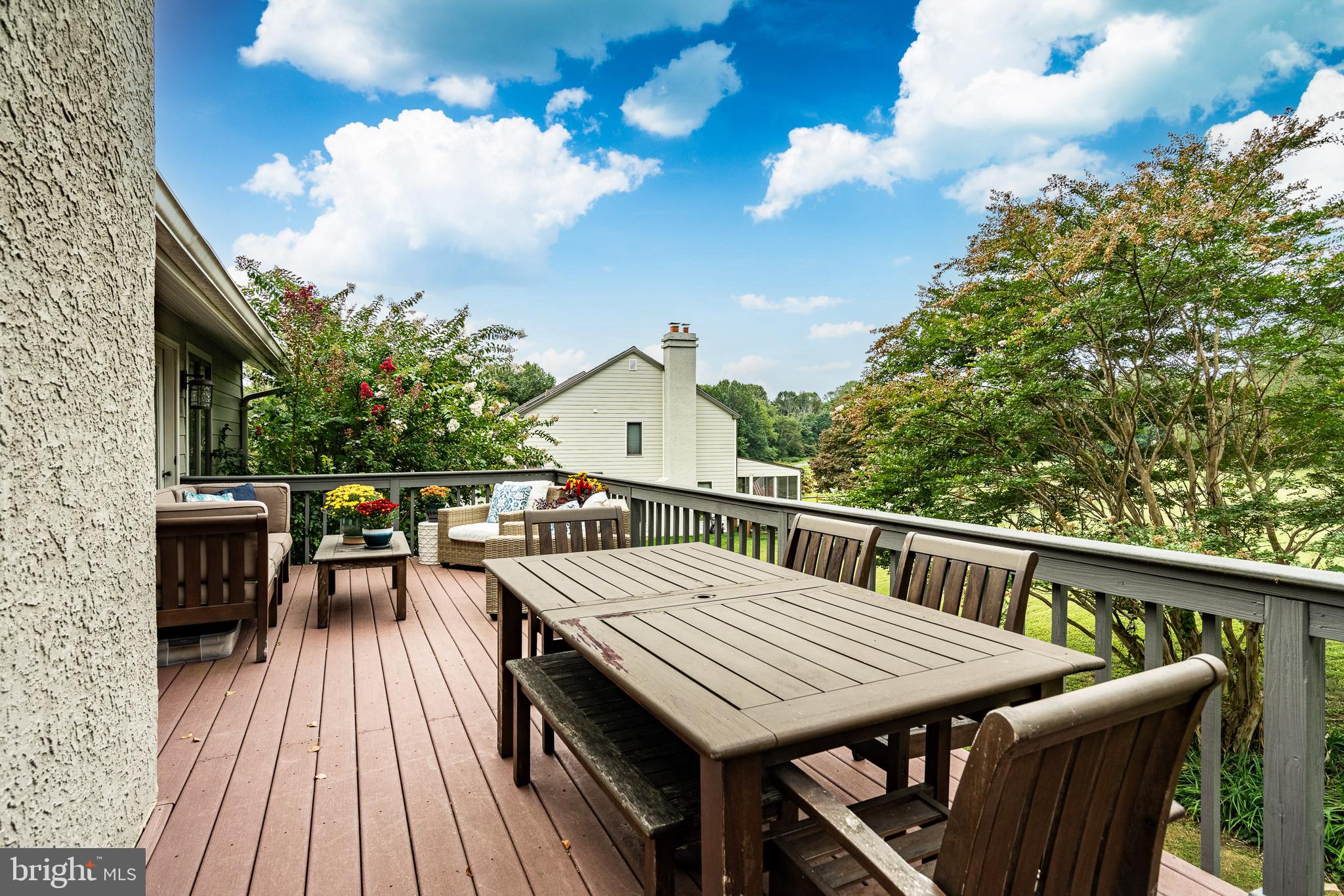 19 Ringfield Road, Unit 19 Chadds Ford, PA 19317 - Photo 35 of 39 a view of a dinning tables and chairs in deck