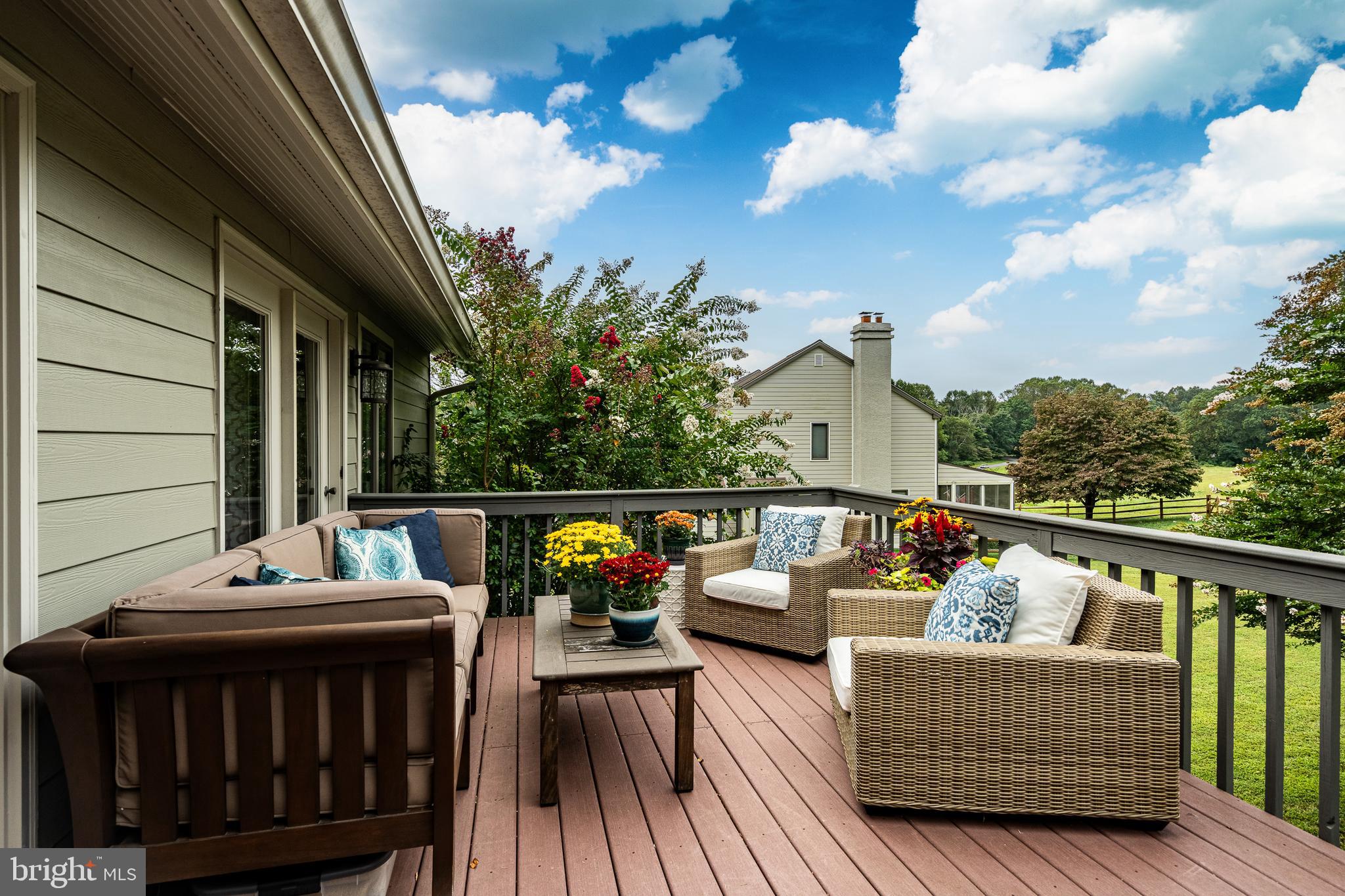 19 Ringfield Road, Unit 19 Chadds Ford, PA 19317 - Photo 36 of 39 a balcony with wooden floor and furniture