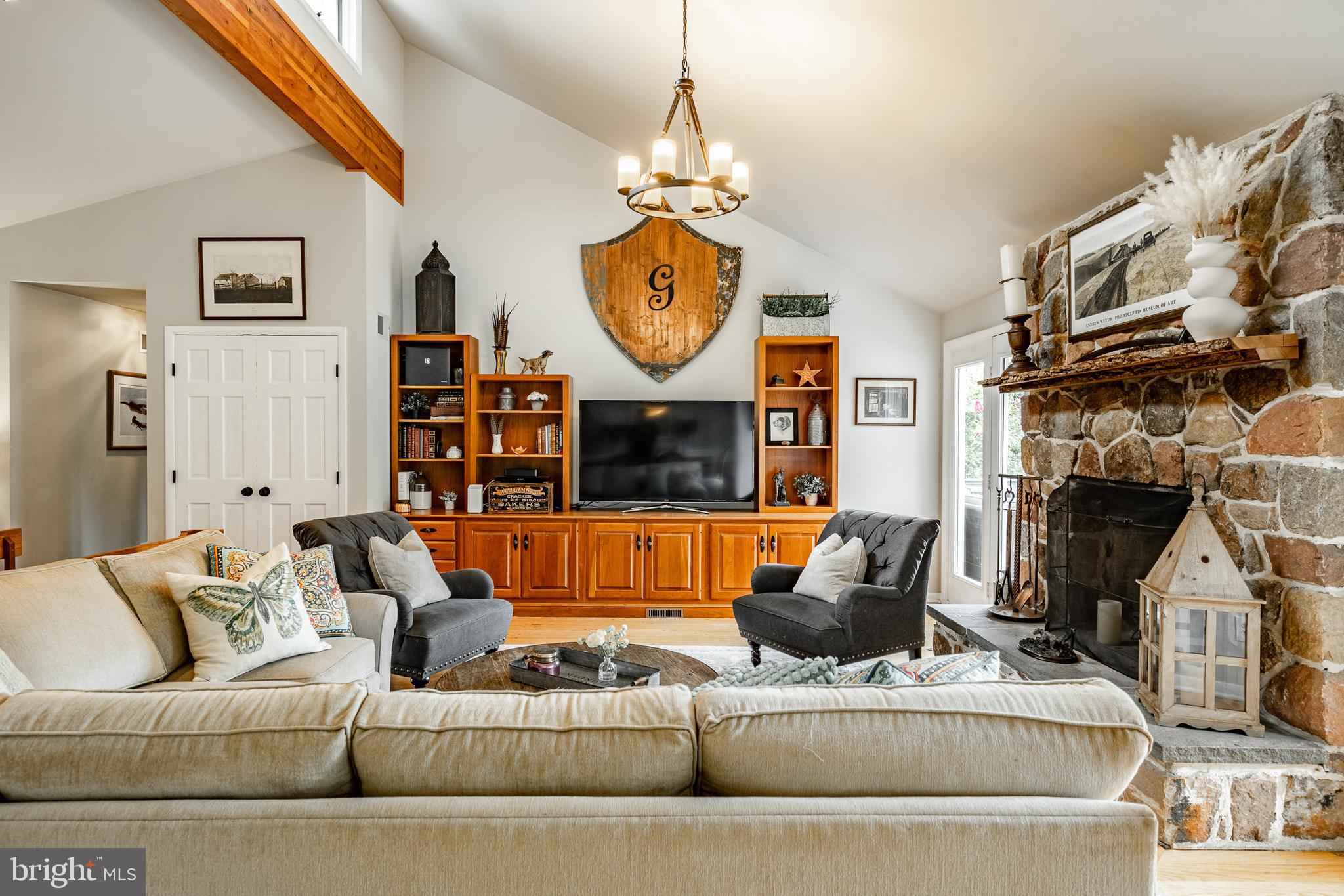 19 Ringfield Road, Unit 19 Chadds Ford, PA 19317 - Photo 8 of 39 a living room with furniture a rug and a fireplace