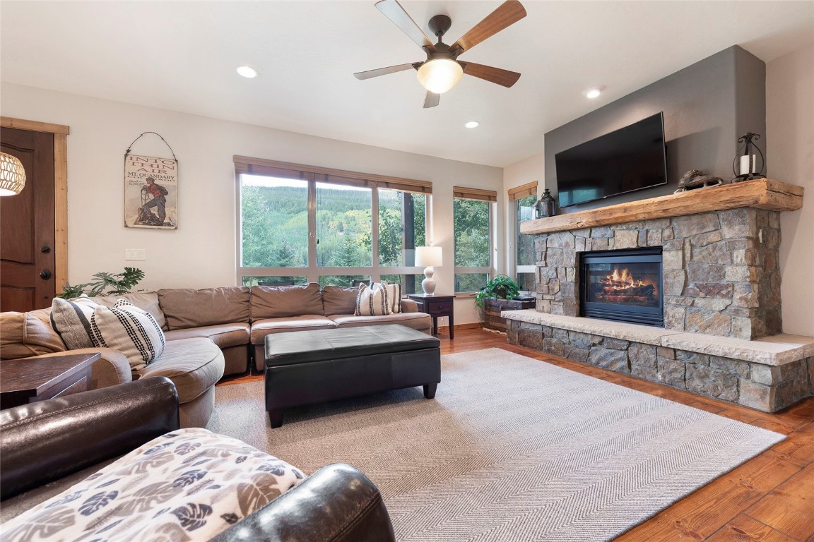 9 Davis Court Blue River, CO 80424 - Photo 17 of 44 a living room with furniture a fireplace and a flat screen tv