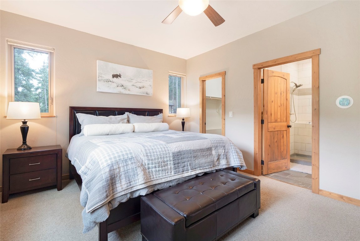 9 Davis Court Blue River, CO 80424 - Photo 19 of 44 a bedroom with a bed and a night stand