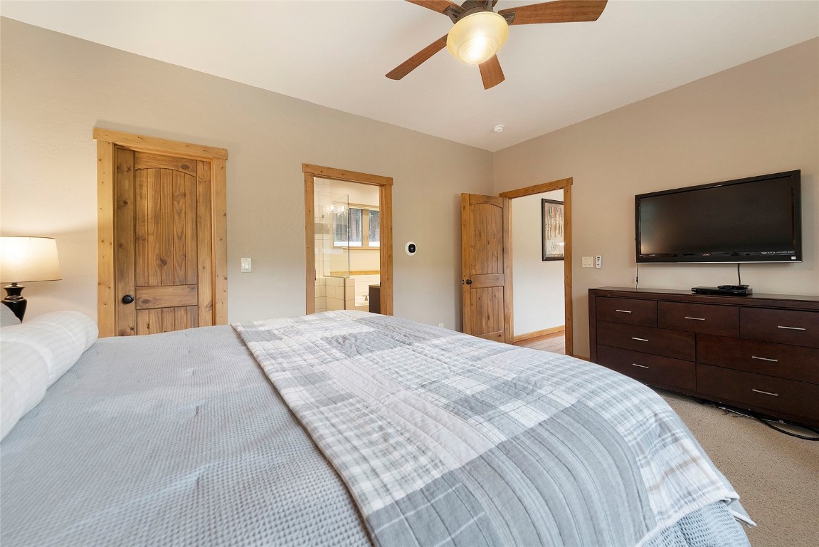9 Davis Court Blue River, CO 80424 - Photo 20 of 44 a bedroom with a bed and a flat screen tv