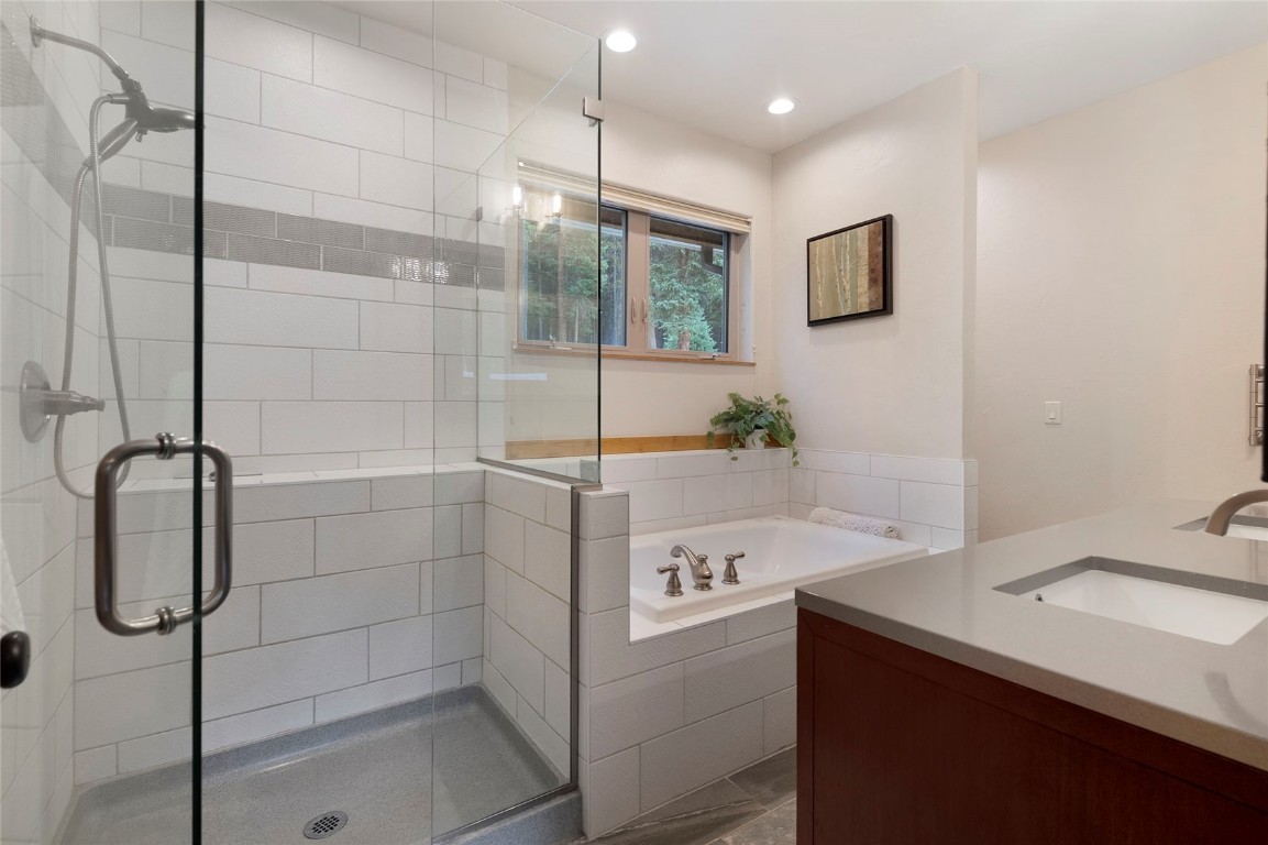 9 Davis Court Blue River, CO 80424 - Photo 21 of 44 a bathroom with a shower sink and mirror