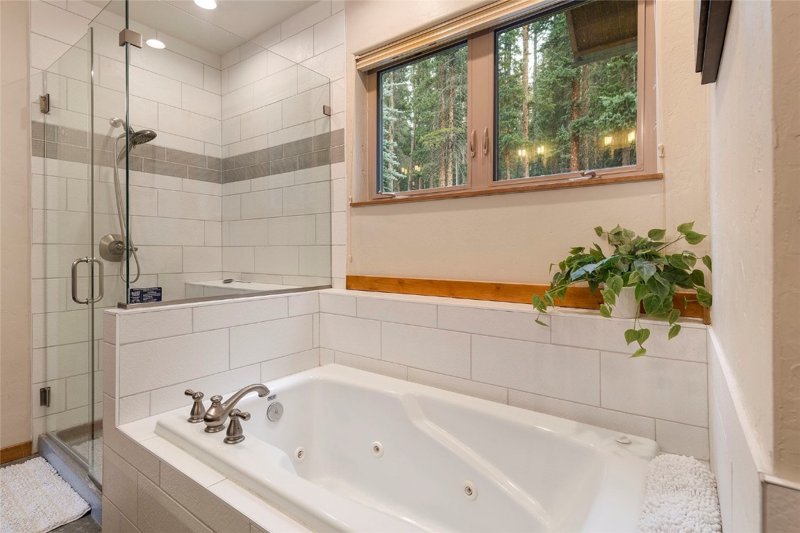 9 Davis Court Blue River, CO 80424 - Photo 23 of 44 a white bath tub sitting next to a shower