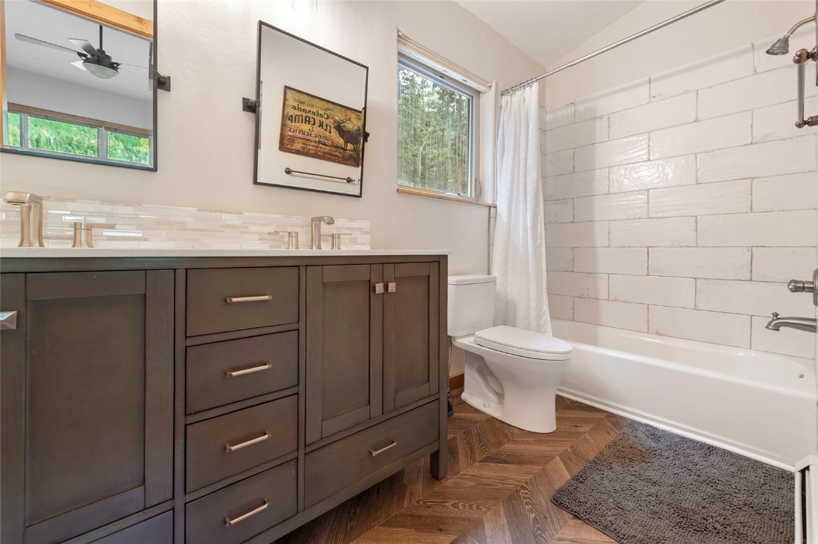 9 Davis Court Blue River, CO 80424 - Photo 29 of 44 a bathroom with a sink a toilet and bathtub