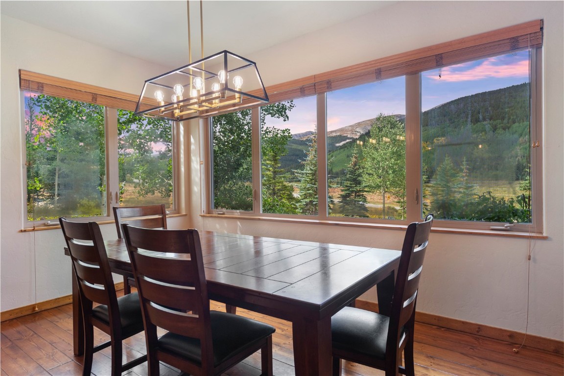 9 Davis Court Blue River, CO 80424 - Photo 10 of 44 a dining room with furniture a chandelier and wooden floor