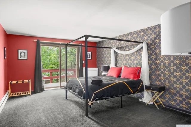 a bedroom with a bed and a chair