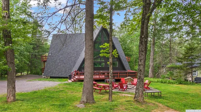 a view of a table and chairs in a yard